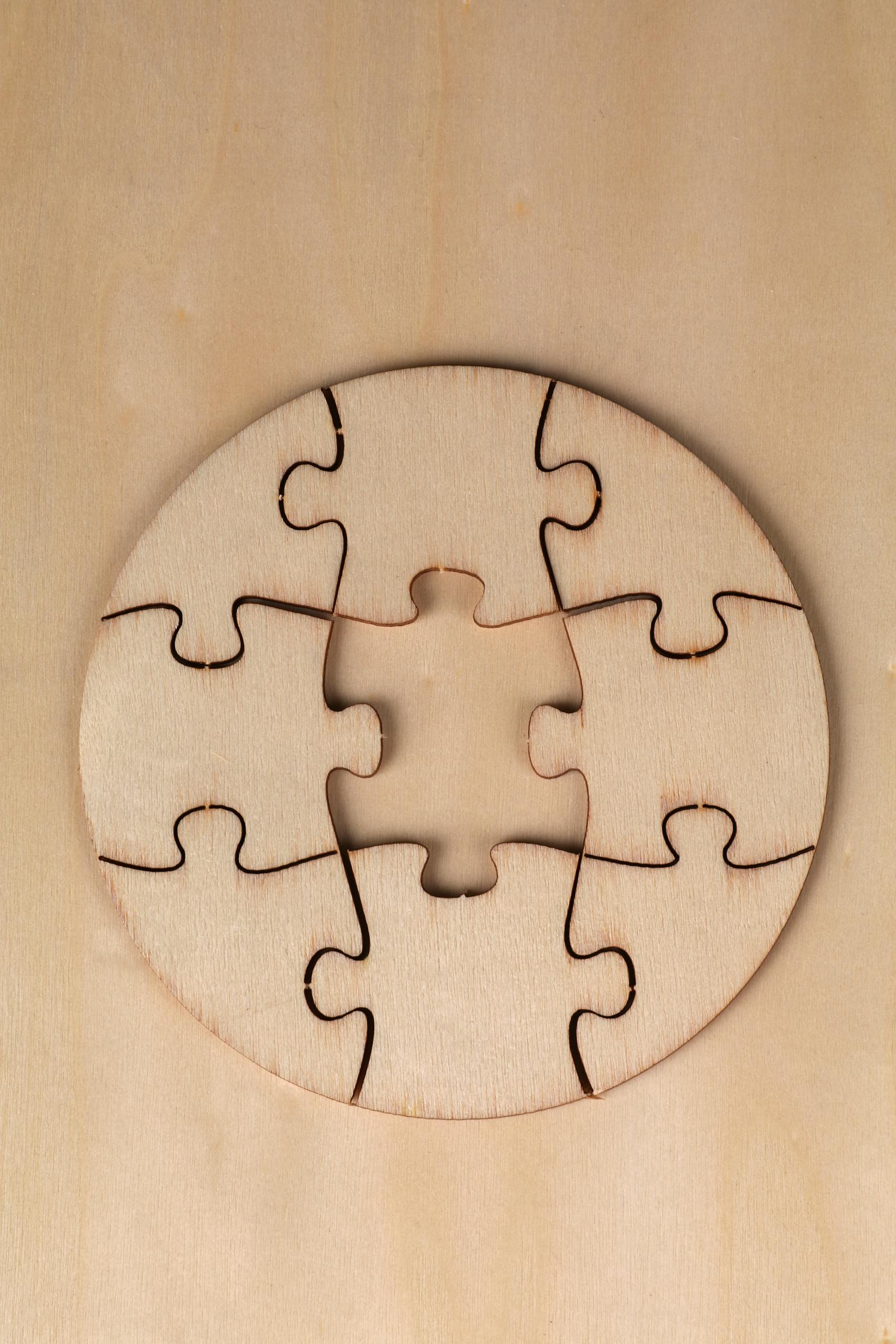 Breaking the Habit of Being Yourself Round wooden puzzle with missing piece on a wooden background, top view.